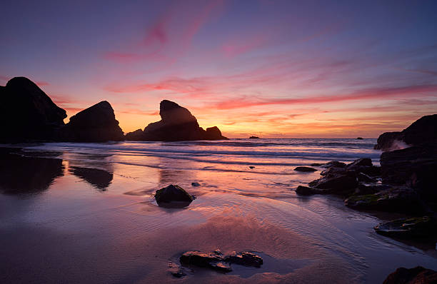 Beautiful sunset at Porthcothan Beach. Cornwall, England. During low tide.