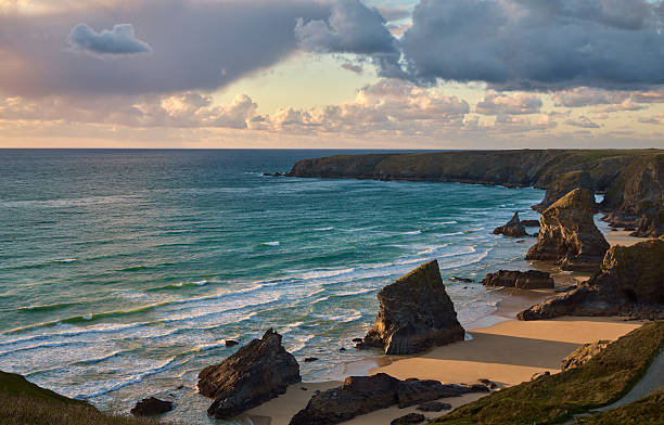 istock Beach at Bedrutheran Steps in Cornwall, England during sunset 2230779432