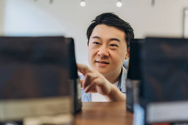 Coffee shop owner choosing coffee beans for his business