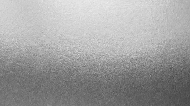 istock Silver background foil leaf metallic texture wrapping paper shiny glowing white grey solid reflective gradient color metal pattern backdrop for wallpaper decoration element backdrop 2230782088