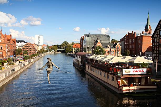People visit riverfront in Bydgoszcz. Bydgoszcz is the capital of region Kujawsko-Pomorskie visited by 2.25m tourists annually (2008).