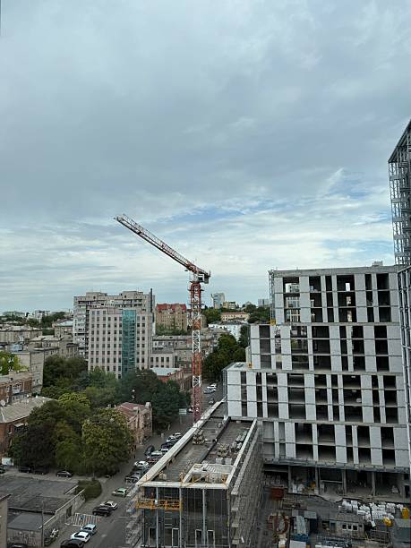 istock Tower crane at construction site in city 2230786937