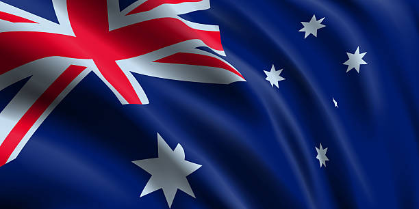 istock National flag Avstralia flies. Australian flag 3d realistic. Close up side view. 2230792507