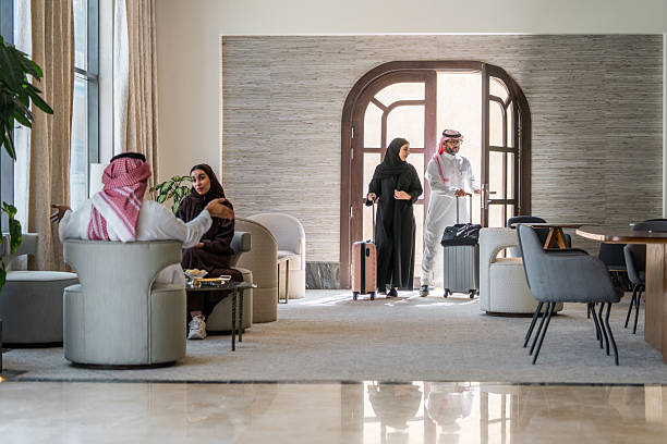 istock Joyful Arabic Couple Arriving at Luxurious Hotel 2230794510