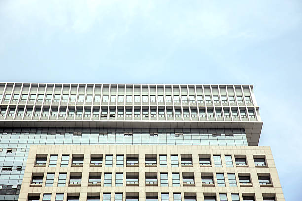 Low angle view of office buildings under clear sky