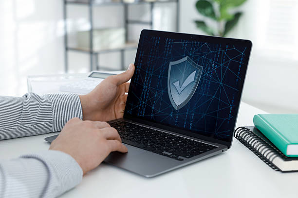 istock Cyber security. Man using laptop at white table indoors, closeup 2230797123
