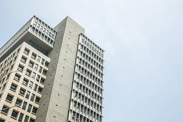 Low angle view of office buildings under clear sky