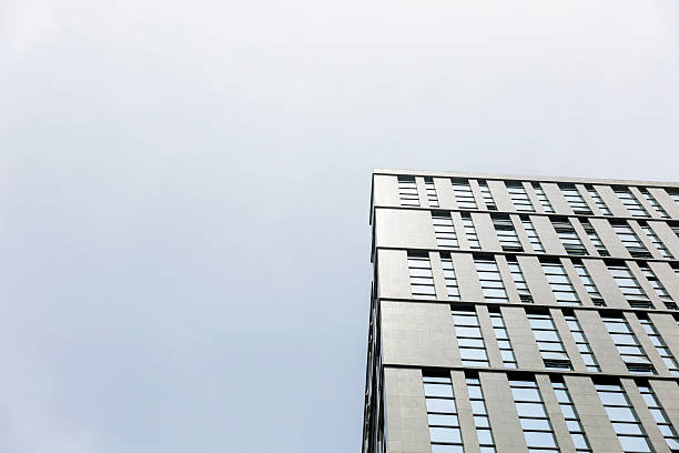 istock Low angle view of office buildings under clear sky 2230797404