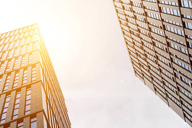 istock Low angle view of office buildings under clear sky 2230797855