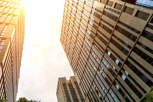 istock Low angle view of office buildings under clear sky 2230797951