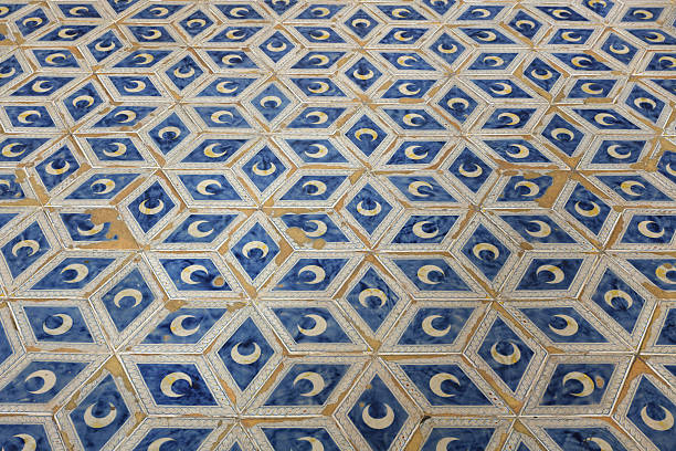istock Ceramic floor tiles with crescent moon patterns in the Piccolomini Library, Siena Cathedral, Siena, Italy. 2230798001