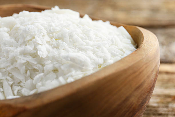 istock White soy wax flakes in bowl on table, closeup 2230798008