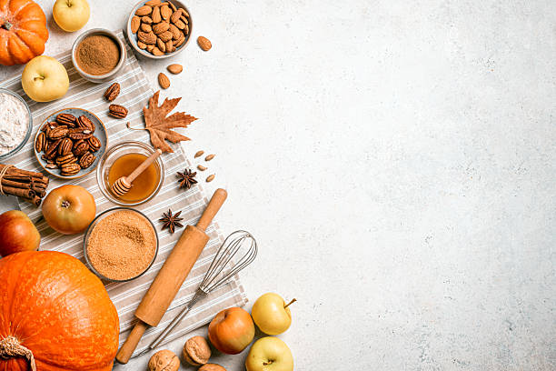 istock Autumn fall baking background with pumpkins, apples, nuts, food ingredients 2230800823