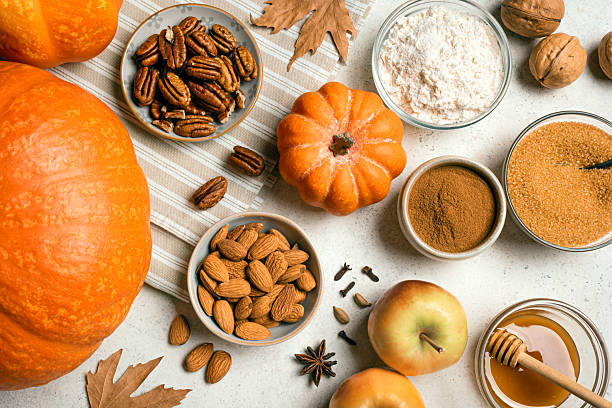 istock Autumn fall baking background with pumpkins, apples and ingredients 2230801314