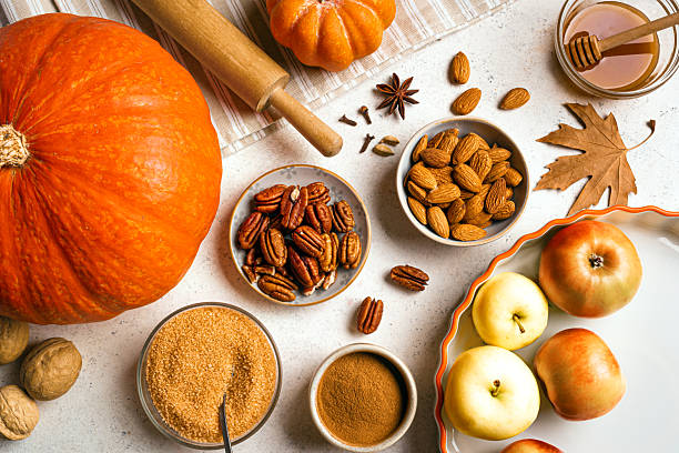 istock Autumn fall baking background with pumpkins, apples and ingredients 2230801401