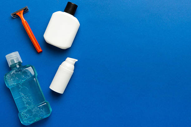 istock Composition with bath cosmetics on table. razor, toothpaste, soap, gel, toothbrush, mouthwash and other various accessories. Cosmetics for skin health. Bath Mockup for your logo 2230801478