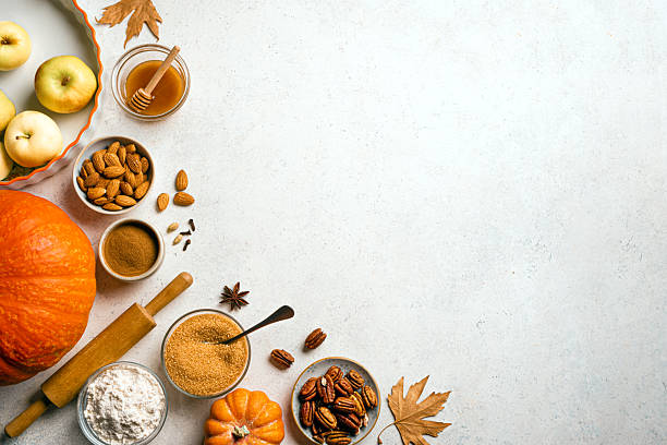 istock Autumn fall baking background with pumpkins, apples, nuts, food ingredients 2230801839