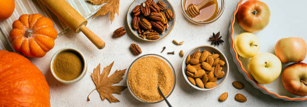 istock Autumn fall baking background with pumpkins, apples and ingredients 2230802233