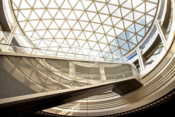 istock Moving escalator at modern illuminated business district 2230803297