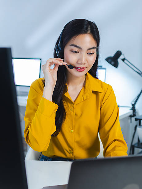istock Female Customer Support Agent Wearing Headset and Working,  giving support to customer at Virtual help desk in office. 2230803531