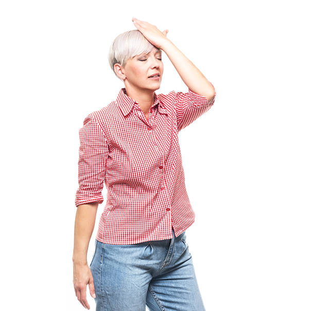 istock Forget concept. Pretty middle aged woman touching her forehead, isolated on white background. Adult woman making a mistake. Copy space. 2230804468