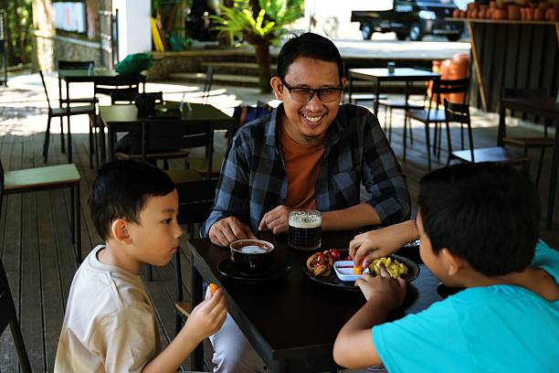 istock Happy family having lunch together 2230804851