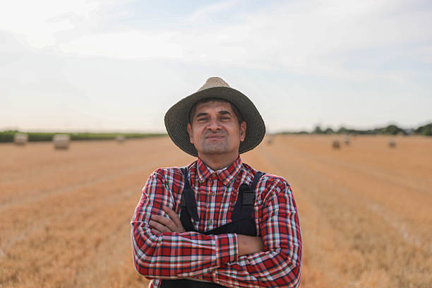 istock Confident Farmer Standing Proudly in Wheat Field 2230805252