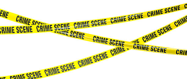istock Yellow crime scene tape isolating an area on white background 2230807563