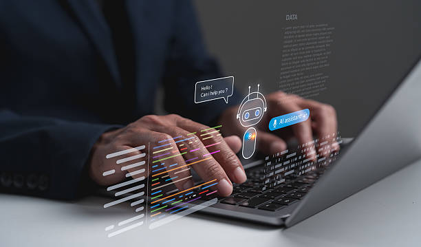 istock A person types on a laptop, interacting with a virtual assistant displayed as holographic text and images, suggesting themes of technology and communication. 2230807848