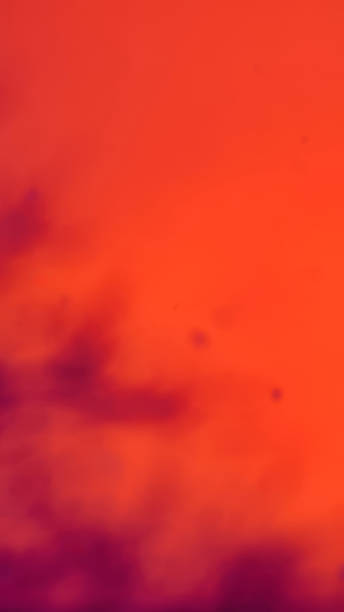 istock Smooth Gradient Transition From Deep Purple To Bright Orange Creating A Vibrant Abstract Background With Warm Energetic Tones. 2230808627
