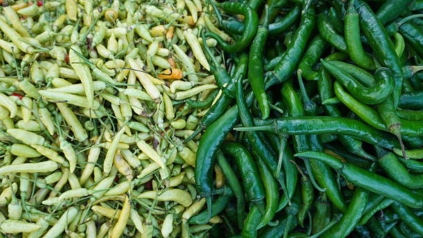 Two Piles of Green Chilies