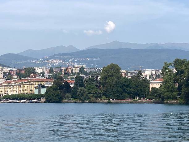 istock Panoramic view of Lake Lugano with architecture in background. 2230810137