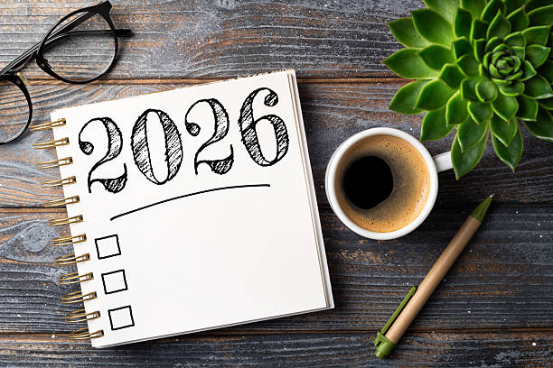 istock New year resolutions 2026 on desk. 2026 resolutions list with notebook, coffee cup on table. Goals, resolutions, plan, action, checklist concept. New Year 2026 template 2230814855