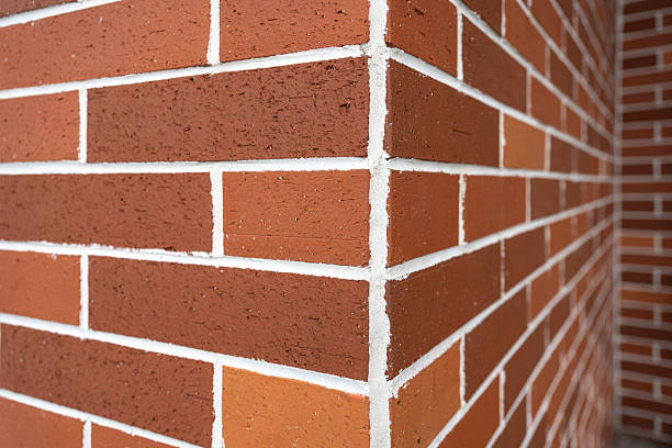 istock Corner of a Brick Wall with White Mortar Joints 2230817906