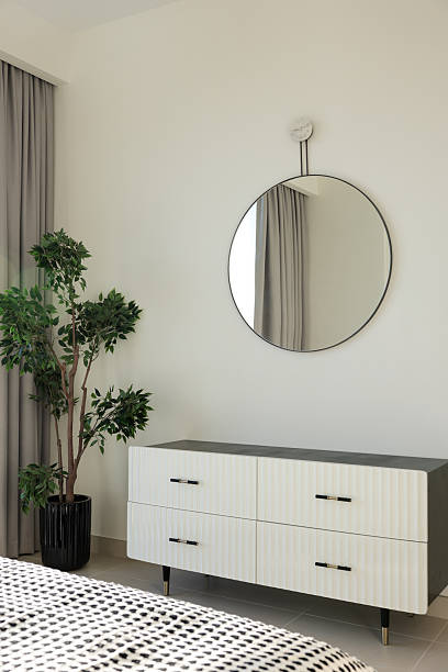 istock Modern bedroom interior with mirror and decorative plant 2230818675