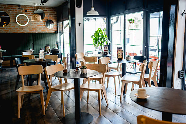 istock Modern coffee shop interior design with empty tables and chairs 2230818996