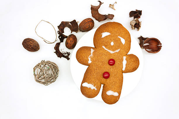 istock Holiday gingerbread cookie with red candy buttons, surrounded by rosemary, walnut silver branch doodle sphere 2230819110