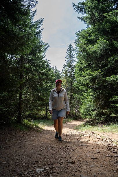istock Woman with Backpack Outdoors 2230823643