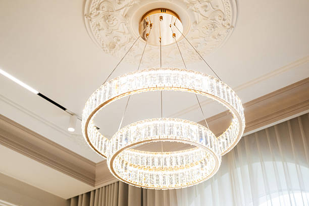 istock Elegant chandelier with modern design illuminating a stylish interior space in soft, warm light 2230827224