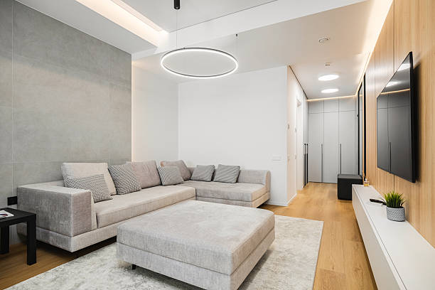istock Modern living room with minimalist design featuring spacious sectional sofa and sleek entertainment unit 2230827776