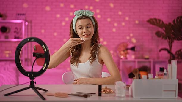istock Engaging Beauty Enthusiast in Vibrant Home Makeup Setup 2230828872