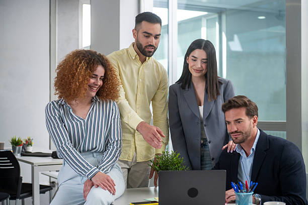 istock Business team collaborating on a project using laptop in office 2230829430