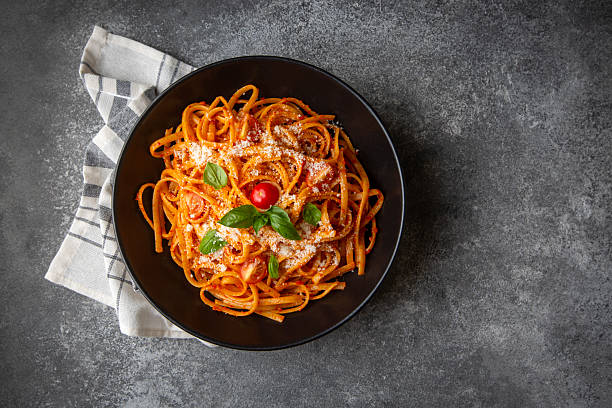 istock Flat spaghetti pasta with delicious tomato sauce and parmesan cheese. 2230834915