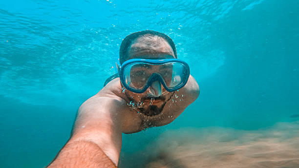 istock Man diving in water with a mask 2230839955