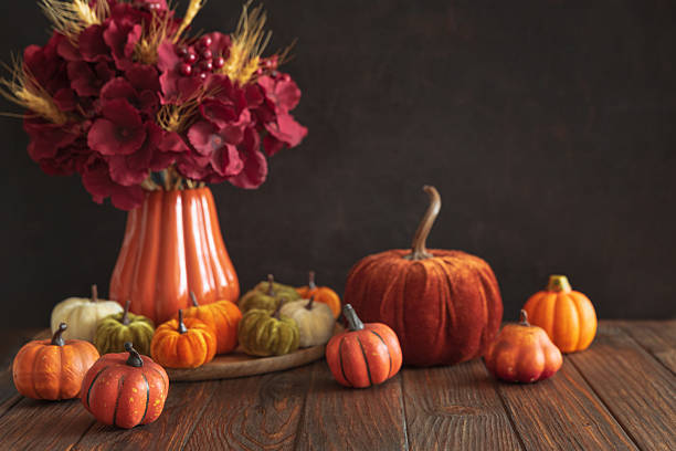 istock Autumnal composition of decorative mini pumpkins on a wooden surface. 2230840266