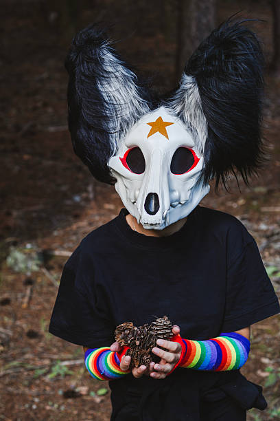 istock Quadrobing character holding pine cones in a forest 2230840960
