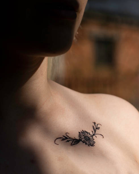 istock Sunflower tattoo on a young womans shoulder 2230844139