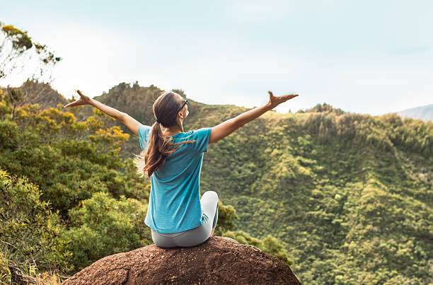 istock Happy woman feeling free joyful in a beautiful mountain nature setting. 2230854975