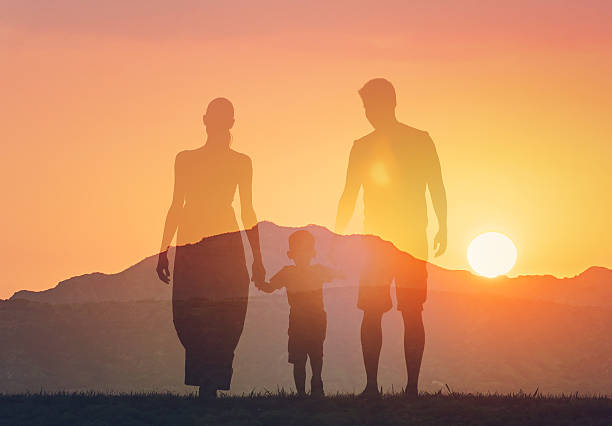 Happy family bonding at sunset.