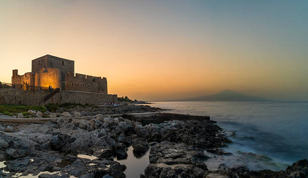 Brucoli Watchtower in front of Mount Etna in Sicily